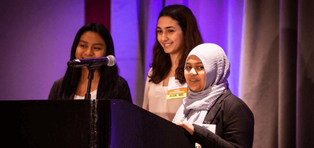girls speaking at event