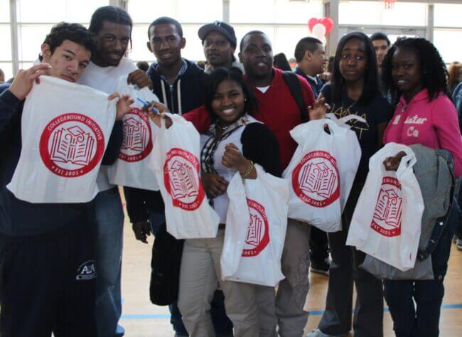 A group of students are attending a college fair and show off their CBI goodie bags.