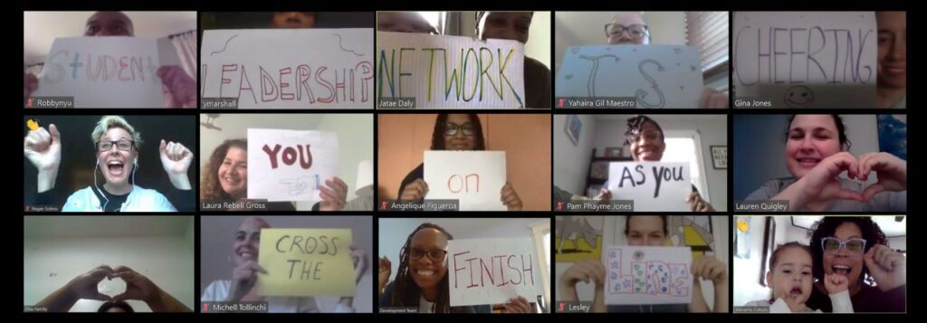 students on Zoom with signs