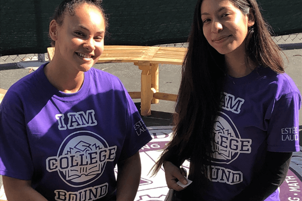 Two students from GALA are wearing purple t-shirts that say "I Am College Bound."