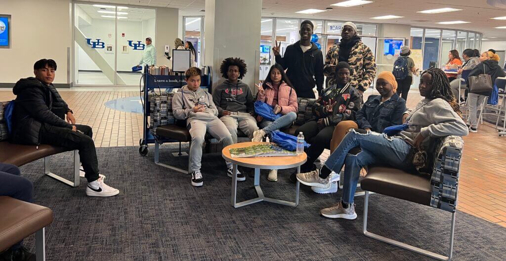A group of students take a break in the student common area at University at Buffalo.