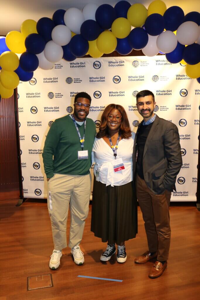 Nike's Brendon M. poses for a picture with SL Network team members, Kristen Gordon of the Girls' Education team and Matthew Checko of the Development team