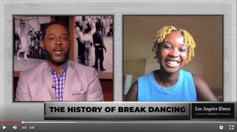 Two reporters face the screen for a news interview.