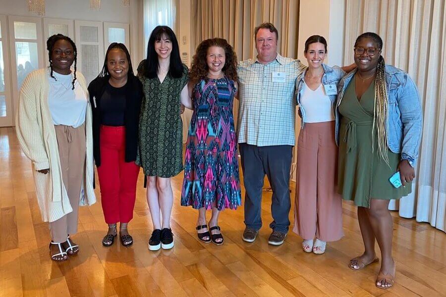 Seven members of the Girls' Education team gather for a photo