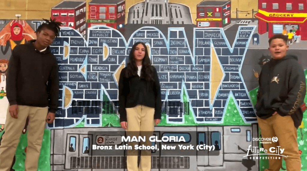 Three students stand in front of colorful mural with "Bronx" in large letters in center