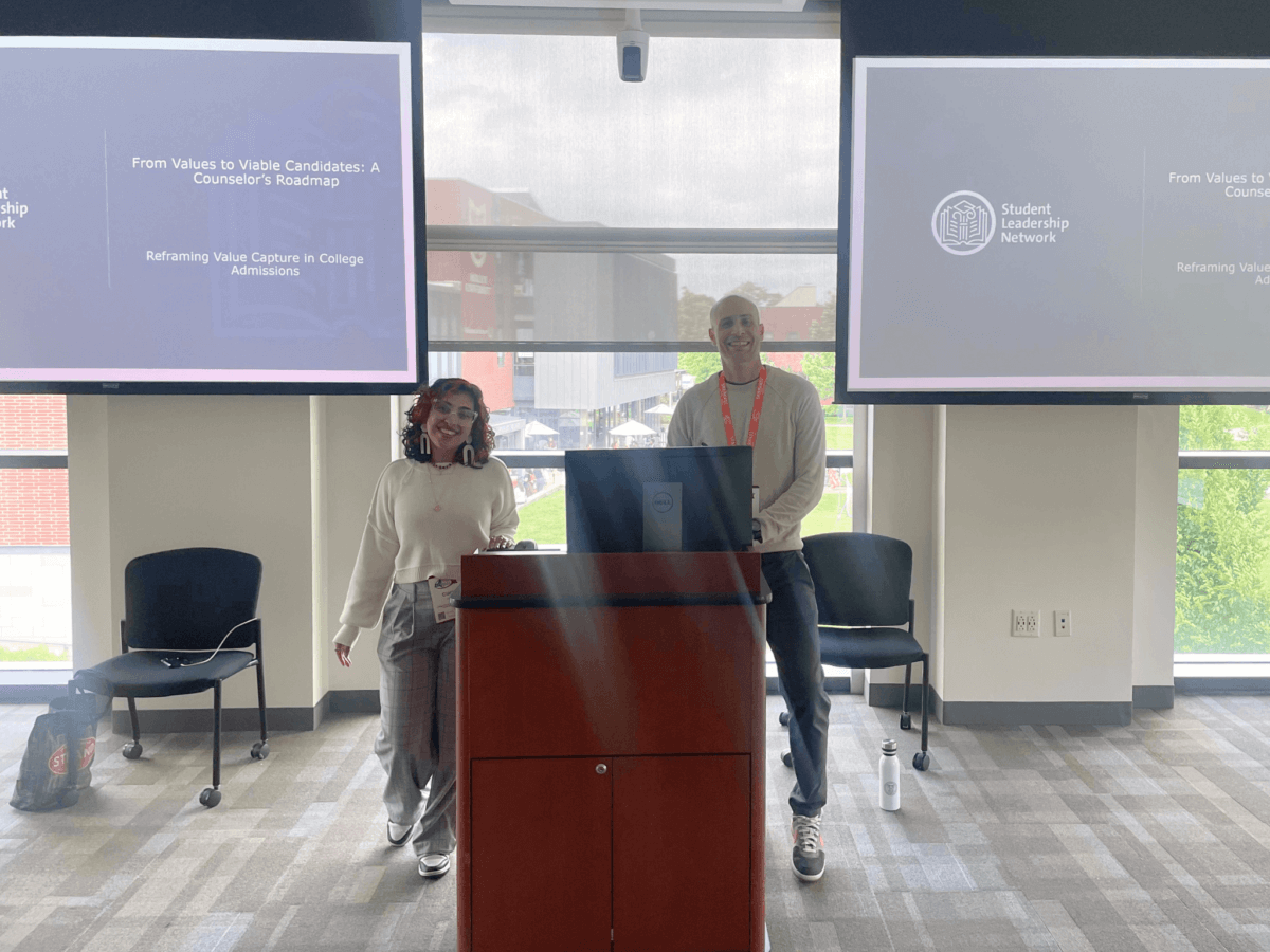 Two college counselors stand at podium ready for their presentation at the NYSACAC Conference