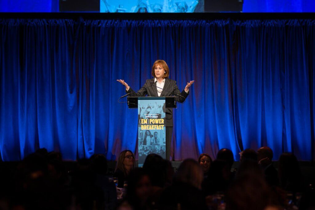 Ann Tisch addresses guests from podium