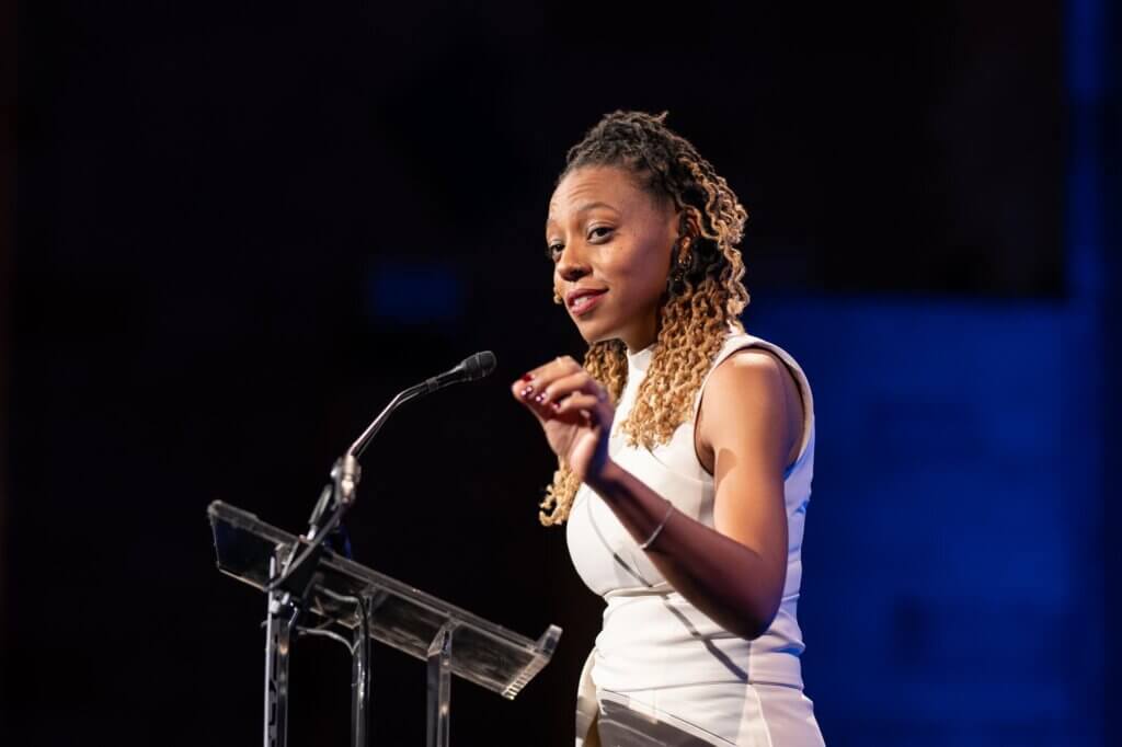 Event honoree Kenya Bryant gestures from podium