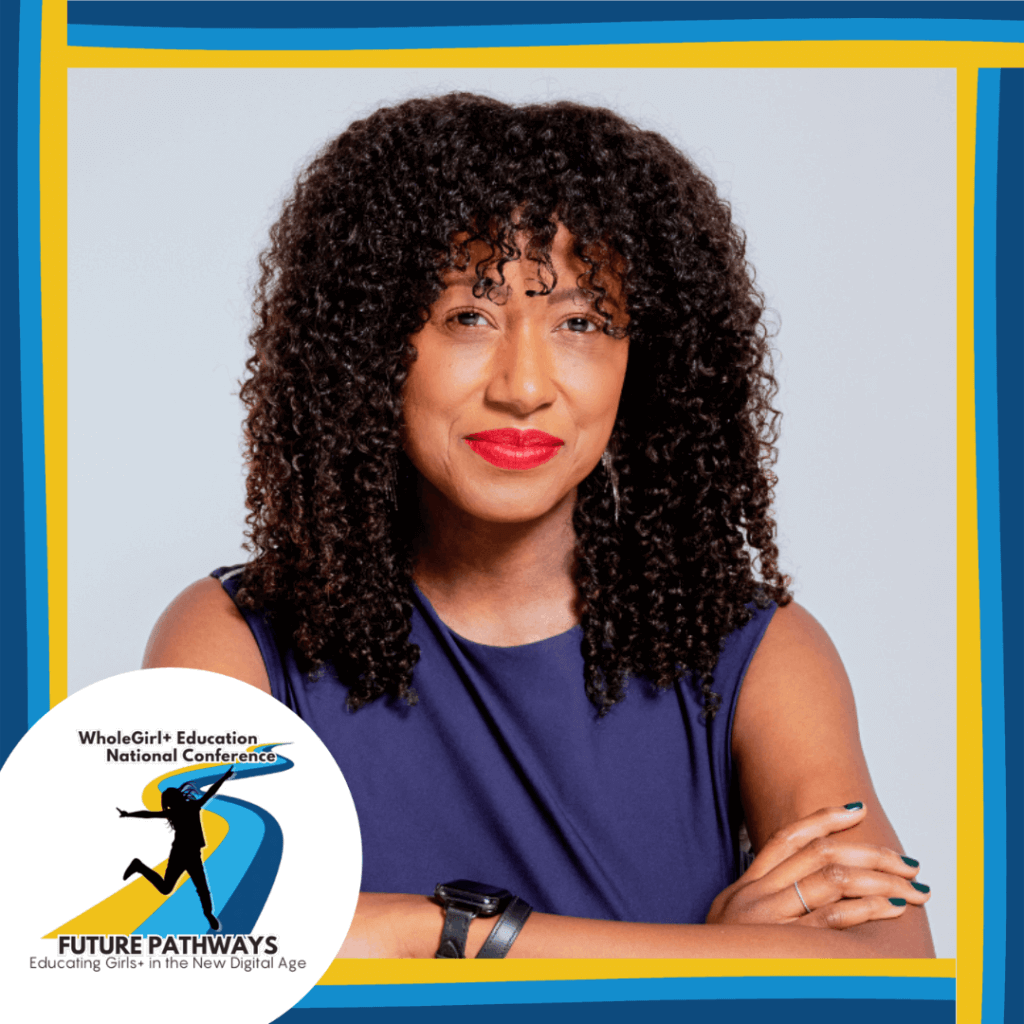 Dr. Tarika Barrett looks to camera confidently, with arms crossed in front