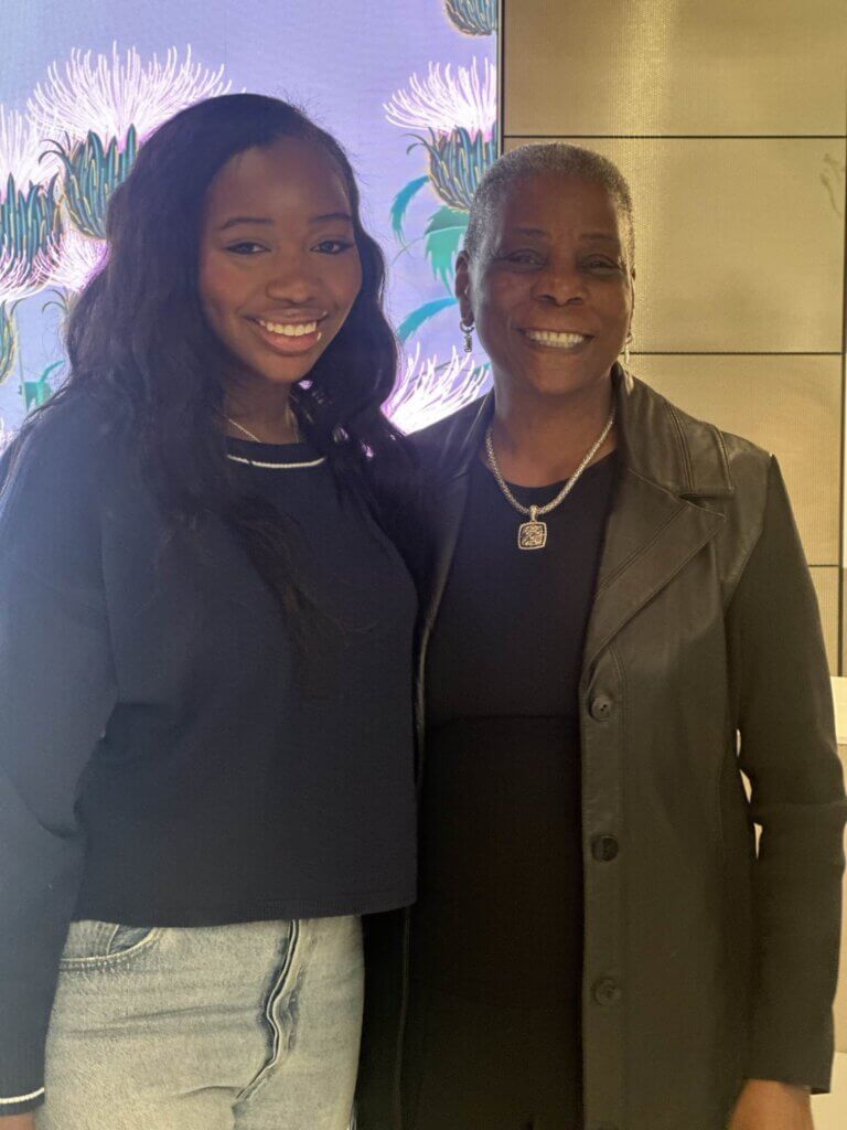 Female student poses for photo with Ursula Burns at Citi Women's History Month event