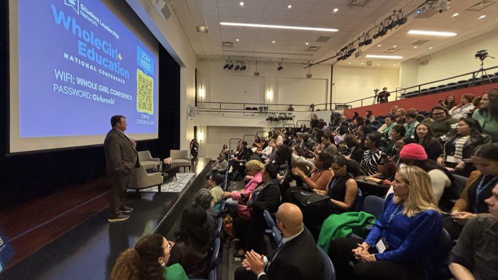 audience seated with stage to the left