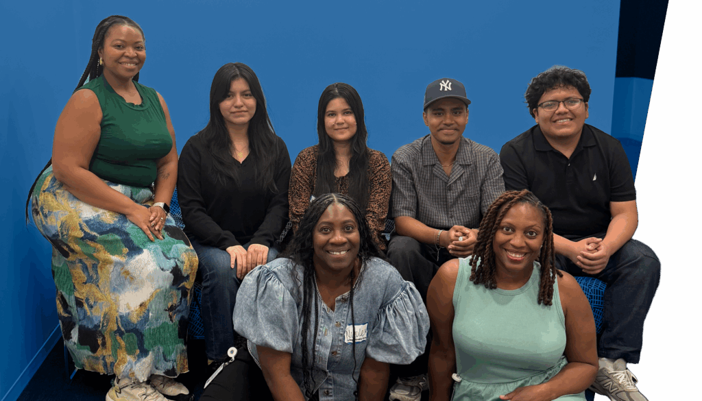 Members of the College Persistence Team and Peer Leaders pose together indoors, with four sitting on a couch and three seated on the floor in front.