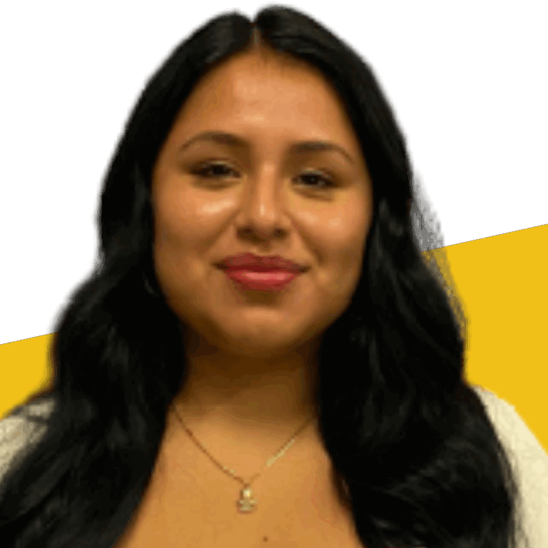 Woman with long black hair, wearing a light top and a necklace, posing in front of a white background with a diagonal yellow section.