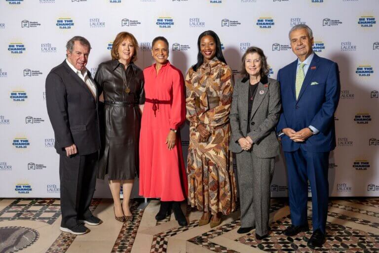 Andrew and Ann Tisch, Soledad O'Brian, Yolonda Marshall, and Lois and Richard Nicotra stand side by side in formal attire at the (Em)Power Breakfast