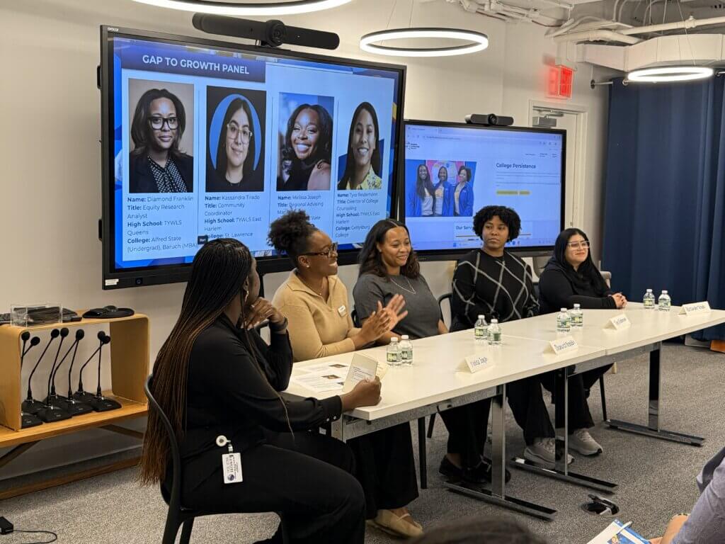 Panelists seated at a table share stories of taking gap time from school or work