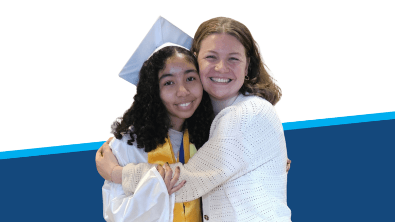 A young graduate in a cap and gown with a yellow stole is hugging her college counselor, who later hires her as a peer mentor