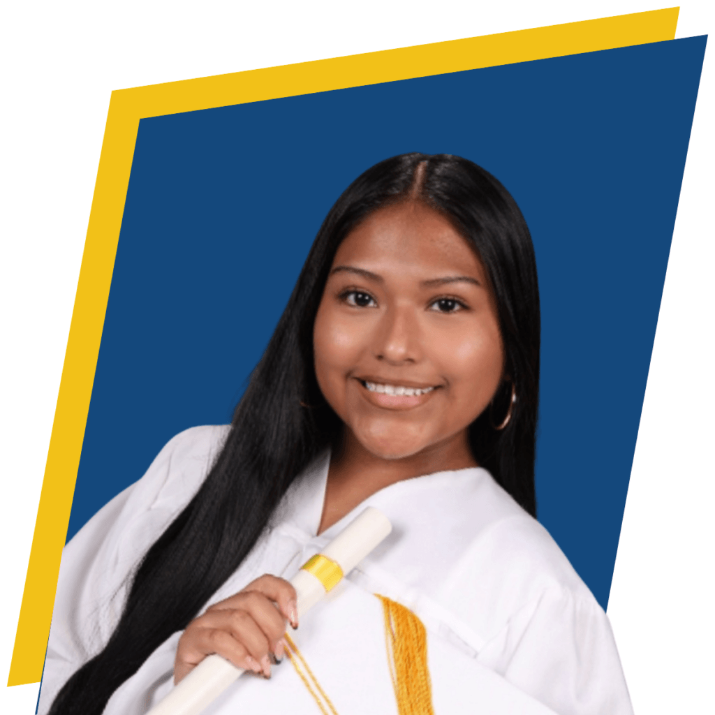 Young woman in a white graduation gown holding a diploma and gold sash, smiling in front of a blue and yellow background.