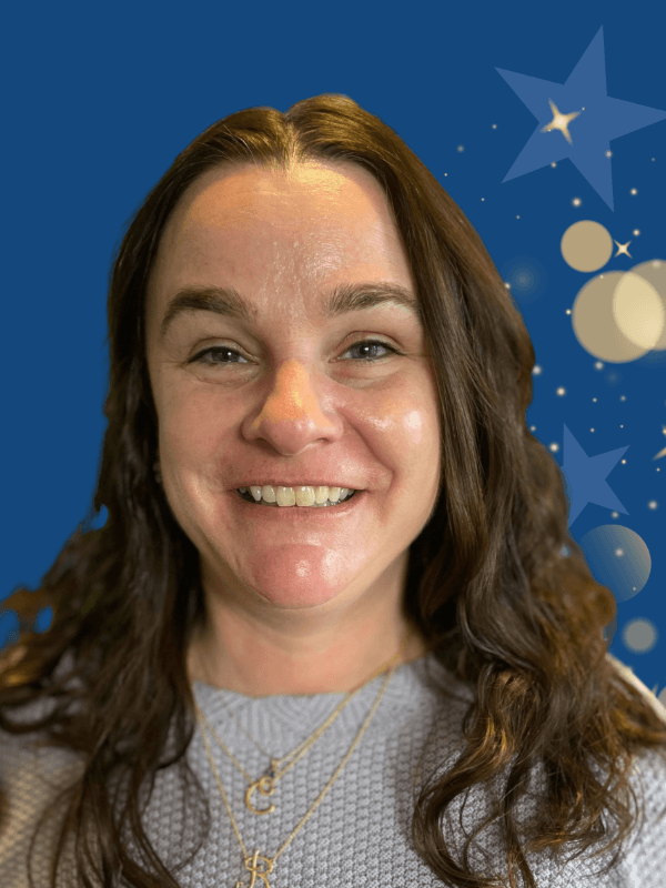 Woman with long brown hair smiling in front of a blue background with decorative stars and circles, a design used for Volunteer Appreciation Week content on the page