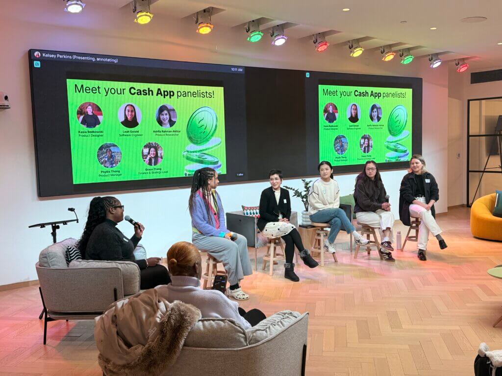 Six women participate in a panel discussion in a modern room; a large screen behind them displays “Meet your Cash App panelists!” with panelist names and images, highlighting key insights from the 2025 Annual Report.