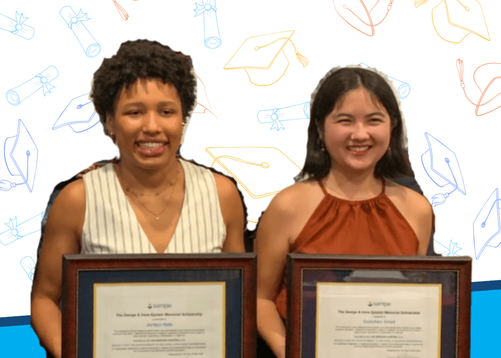 Two young women stand side by side, each holding a framed scholarship certificate